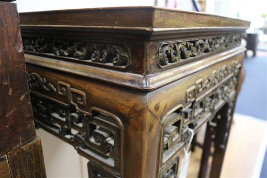 A Chinese huali wood urn stand, having panelled top and pierced frieze W.52cm